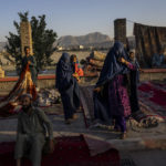 
              FILE - In this Wednesday, Sept. 15, 2021, file photo, Afghan women walk through a second-hand market where many families sold their belongings before leaving the country or due to financial struggle, in Kabul, Afghanistan. On Friday, Sept. 17, 2021, The Associated Press reported on stories circulating online incorrectly asserting that CNN had reported that the Taliban banned menstrual hygiene products in Afghanistan, saying it goes against Sharia law. CNN did not publish such an article and no credible reports can be found to support any such action by the Taliban. A closer look at the post shows that the CNN logo was flipped and the font does not match the cable news network’s logo. (AP Photo/Bernat Armangue, File)
            