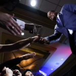 
              Republican conservative radio show host Larry Elder greets supporters after losing the California gubernatorial recall election Tuesday, Sept. 14, 2021, in Costa Mesa, Calif. The rare, late-summer election, which challenged California Governor Gavin Newsom, has emerged as a national battlefront on issues from COVID-19 restrictions to climate change. (AP Photo/Ashley Landis)
            