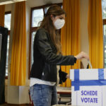
              A woman casts her ballot for the abortion referendum at a polling station in San Marino, Sunday, Sept. 26, 2021. Tiny San Marino is one of the last countries in Europe which forbids abortion in any circumstance — a ban that dates from 1865. Its citizens are voting Sunday in a referendum calling for abortion to be made legal in the first 12 weeks of pregnancy. (AP Photo/Antonio Calanni)
            