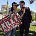 
              Assemblyman Kevin Kiley, right, of Rocklin, a Republican candidate for governor in the Sept. 14 recall election, speaks with supporter Nancy Jiang during a campaign stop outside of Manual Arts High School, Monday, Sept. 13, 2021, in Los Angeles. (AP Photo/Marcio Jose Sanchez)
            