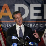 
              California Gov. Gavin Newsom addresses reporters after beating back the recall that aimed to remove him from office at the John L. Burton California Democratic Party headquarters in Sacramento, Calif., Tuesday, Sept. 14, 2021. (AP Photo/Rich Pedroncelli)
            