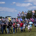 
              Supporters file into the Georgia National Fairgrounds in Perry, Ga., to attend former president Donald Trump's Save America rally Saturday, Sept. 25, 2021. (AP Photo/Ben Gray)
            