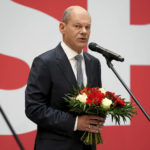 
              Olaf Scholz, top candidate for chancellor of the Social Democratic Party (SPD), attends a press statement at the party's headquarter in Berlin, Germany, Monday, Sept. 27, 2021. The center-left Social Democrats have won the biggest share of the vote in Germany's national election. They narrowly beat outgoing Chancellor Angela Merkel's center-right Union bloc in a closely fought race that will determine who succeeds the long-time leader at the helm of Europe's biggest economy. (AP Photo/Michael Sohn)
            