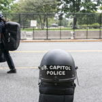 
              Police stage at a security fence ahead of a rally near the U.S. Capitol in Washington, Saturday, Sept. 18, 2021. The rally was planned by allies of former President Donald Trump and aimed at supporting the so-called "political prisoners" of the Jan. 6 insurrection at the U.S. Capitol. (AP Photo/Nathan Howard)
            