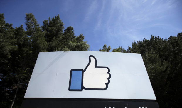 FILE - In this April 14, 2020 file photo, the thumbs up Like logo is shown on a sign at Facebook he...