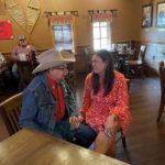 
              Former White House Press Secretary Sarah Sanders talks to Harold Glenn Earnest while campaigning at a Colton's Steak House in Cabot, Ark., Friday, Sept. 10, 2021. Sanders is running for the Republican nomination for governor in Arkansas. (AP Photo/Andrew DeMillo)
            