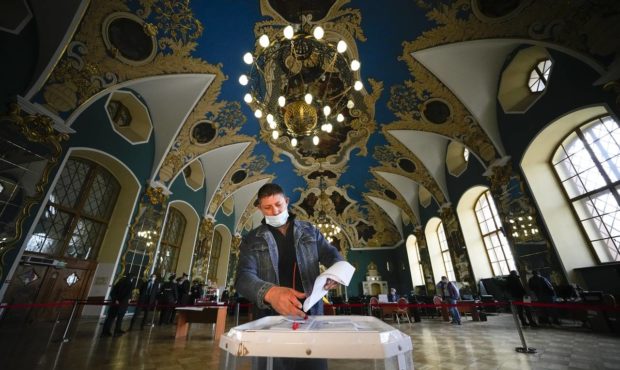 A man casts his ballot at a polling station at the Kazansky railway station during the Parliamentar...