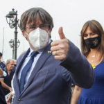 
              Catalan separatist leader Carles Puigdemont, left, gives thumbs up as he walks with the Speaker of the Catalan Parliament Laura Borras in Alghero, Sardinia, Italy, Saturday, Sept. 25, 2021. Puigdemont took a leisurely walk in the Sardinian city, waving to supporters, a day after a judge freed him from jail pending a hearing on his extradition to Spain, where the political firebrand is wanted for sedition. (AP Photo/Francesca Salaris)
            