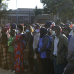 
              People wait in a queue to be vaccinated at a government hospital in Harare, Zimbabwe on Friday, Sept, 17, 2021. Many employers in Zimbabwe are mandating COVID-19 vaccines for their staff, and the government has its own requirement that its 500,000 employees get the shots. That sets the southern African nation apart from nearly every other on the continent, where the most immediate challenge is still simply acquiring enough doses. (AP Photo/Tsvangirayi Mukwazhi)
            