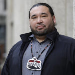 
              FILE - In this Nov. 14, 2019, file photo, Makah Tribe Vice Chairman Patrick DePoe poses for a photo before a federal hearing to help determine whether his small American Indian tribe from Washington state can once again hunt whales in Seattle. Nearly two years after the hearing, an administrative law judge on Thursday, Sept. 23, 2021, recommended that the Makah be allowed to resume whaling along the coast as their ancestors did. (AP Photo/Elaine Thompson, File)
            
