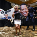 
              Supporters of republican conservative radio show host Larry Elder gather as polls close for the California gubernatorial recall election Tuesday, Sept. 14, 2021, in Costa Mesa, Calif. The rare, late-summer election, which challenged California Governor Gavin Newsom, has emerged as a national battlefront on issues from COVID-19 restrictions to climate change. (AP Photo/Ashley Landis)
            