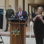 
              FILE - In this April 13, 2021, file photo, Cal Poly President Jeffrey Armstrong, center, speaks during a news conference in San Luis Obispo, Calif. At left is a photo of student Kristin Smart. A California judge is expected to rule Wednesday, Sept. 22, 2021, whether a father and son face trial on charges related to the disappearance 25 years earlier of Smart. (David Middlecamp/The Tribune (of San Luis Obispo) via AP, File)
            