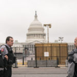 
              Police stand outside a security fence ahead of a rally near the U.S. Capitol in Washington, Saturday, Sept. 18, 2021. The rally was planned by allies of former President Donald Trump and aimed at supporting the so-called "political prisoners" of the Jan. 6 insurrection at the U.S. Capitol. (AP Photo/Nathan Howard)
            