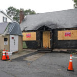 
              A home that was seriously damaged by fire is seen, Tuesday, Sept. 28, 2021, in Melrose, Mass. WBZ-TV reported that the $399,000 asking price for the home in Melrose, a suburb of Boston, is evidence of how hot the housing market is in the state. The online listing for the burned, three bedroom, 1,857-square foot home says it is in need of complete renovation and is being sold as is. (AP Photo/Elise Amendola)
            
