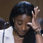 
              United States Olympic gymnast Simone Biles testifies during a Senate Judiciary hearing about the Inspector General's report on the FBI's handling of the Larry Nassar investigation on Capitol Hill, Wednesday, Sept. 15, 2021, in Washington. Nassar was charged in 2016 with federal child pornography offenses and sexual abuse charges in Michigan. He is now serving decades in prison after hundreds of girls and women said he sexually abused them under the guise of medical treatment when he worked for Michigan State and Indiana-based USA Gymnastics, which trains Olympians. (Graeme Jennings/Pool via AP)
            