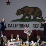 
              President Joe Biden, left, waves to the crowd as he walks toward the podium to join California Gov. Gavin Newsom at a rally ahead of Tuesday's recall election Monday, Sept. 13, 2021, in Long Beach, Calif. (AP Photo/Jae C. Hong)
            