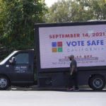 
              A truck with a digital sign reminding people of the Sept. 14 recall election is parked in a shopping center in Sacramento Calif., Thursday, Sept. 9, 2021. Democratic state lawmakers Sen. Steve Glazer and Assemblyman Marc Berman called for reforming the recall election requirements, Wednesday Sept. 15, 2021. This could include increasing the number of signatures to force a recall election, raising the standards to require malfeasance on the part of the office-holder and change the current process in which someone with a small percentage of votes could replace a sitting governor. (AP Photo/Rich Pedroncelli)
            
