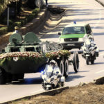 
              The convoy carrying the coffin of former Algerian President Abdelaziz Bouteflika drives on its way to the El Alia cemetery in Algiers, Sunday, Sept.19, 202. Algeria's leader declared a three-day period of mourning starting Saturday for former President Abdelaziz Bouteflika, whose 20-year-long rule, riddled with corruption, ended in disgrace as he was pushed from power amid huge street protests when he decided to seek a new term. Bouteflika, who had been ailing since a stroke in 2013, died Friday at 84. (AP Photo/Fateh Guidoum)
            