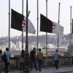 
              Algerian flags fly at half-staff along the seaside walk in Algiers, Saturday, Sept. 18, 2021. Algeria's leader declared a three-day period of mourning starting Saturday for former President Abdelaziz Bouteflika, whose 20-year-long rule, riddled with corruption, ended in disgrace as he was pushed from power amid huge street protests when he decided to seek a new term. Bouteflika, who had been ailing since a stroke in 2013, died Friday at 84. (AP Photo/Fateh Guidoum)
            