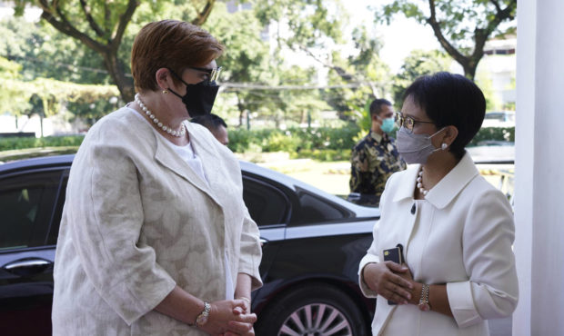 In this photo released by the Indonesian Ministry of Foreign Affairs, Australian Foreign Minister M...