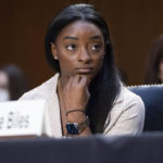
              United States Olympic gymnast Simone Biles testifies during a Senate Judiciary hearing about the Inspector General's report on the FBI's handling of the Larry Nassar investigation on Capitol Hill, Wednesday, Sept. 15, 2021, in Washington. Nassar was charged in 2016 with federal child pornography offenses and sexual abuse charges in Michigan. He is now serving decades in prison after hundreds of girls and women said he sexually abused them under the guise of medical treatment when he worked for Michigan State and Indiana-based USA Gymnastics, which trains Olympians. (Saul Loeb/Pool via AP)
            