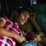 
              Fany Sirei, 38, from Honduras rests next to her 15-month-old child Junior Yair at a shelter, Friday, Sept. 17, 2021, in Ciudad Acuña, Mexico. Sirei has been waiting for six months in Mexico to enter the United States.(Marie D. De Jesús/Houston Chronicle via AP)
            