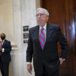 
              Senate Minority Leader Mitch McConnell, R-Ky., returns to the Senate chamber for a vote after attending a bipartisan barbecue luncheon, at the Capitol in Washington, Thursday, Sept. 23, 2021. (AP Photo/J. Scott Applewhite)
            