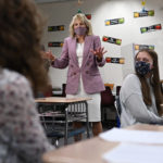 
              FILE - In this March 3, 2021, file photo speaks with students as she tours Fort LeBoeuf Middle School in Waterford, Pa. Jill Biden is going back to her whiteboard. After months of teaching writing and English to community college students in boxes on a computer screen, the first lady resumes teaching in person on Tuesday, Sept. 7, from a classroom at Northern Virginia Community College, where she has worked since 2009. (Mandel Ngan/Pool via AP, File)
            