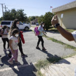 
              A member of a humanitarian group, right, greets migrants after they were released from U.S. Customs and Border Protection custody, Friday, Sept. 24, 2021, in Del Rio, Texas. (AP Photo/Julio Cortez)
            
