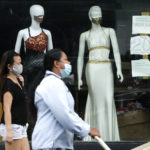 
              FILE - In this Sept. 29, 2020, file photo, women walk past mannequins wearing face masks advertised for sale, at a shop in Makati city, Philippines. Developing economies in Asia will likely grow at a slower pace than earlier expected due to prolonged COVID-19 outbreaks and uneven progress in vaccinations, the Asian Development Bank said in a report Wednesday, Sept. 22, 2021.(AP Photo/Aaron Favila, File)
            