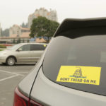 
              A vehicle with a Gadsden flag sticker is parked in the lot at Independence Point, Friday, Sept. 10, 2021, in Coeur d'Alene, Idaho.  Northern Idaho has a long and deep streak of antigovernment activism that is confounding attempts to battle a COVID-19 outbreak.(AP Photo/Young Kwak)
            