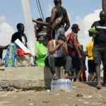 
              Haitian migrants gather on the banks of the Rio Grande after they crossed into the United States from Mexico, Saturday, Sept. 18, 2021, in Del Rio, Texas. The U.S. plans to speed up its efforts to expel Haitian migrants on flights to their Caribbean homeland, officials said Saturday as agents poured into a Texas border city where thousands of Haitians have gathered after suddenly crossing into the U.S. from Mexico. (AP Photo/Eric Gay)
            