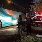 
              Mexican police and National Guard stand near a parked bus near the Rio Grande river in Ciudad Acuna, Mexico, at dawn Thursday, Sept. 23, 2021, on the border with Del Rio, Texas. Mexico has been ramping up efforts to relieve migrant numbers at this segment of the border. (AP Photo/Felix Marquez)
            
