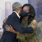 
              Former President Barack Obama hugs his wife, former first lady Michelle Obama, during a groundbreaking ceremony for the Obama Presidential Center, Tuesday, Sept. 28, 2021, in Chicago. (AP Photo/Charles Rex Arbogast)
            