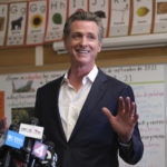 
              Gov. Gavin Newsom speaks to the press after visiting with students at Melrose Leadership Academy, a TK-8 school in Oakland, Calif., on Wednesday, Sept. 15, 2021, one day after defeating a Republican-led recall effort. (AP Photo/Nick Otto)
            