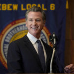 
              Gov. Gavin Newsom speaks to volunteers in San Francisco, Tuesday, Sept. 14, 2021. The recall election that could remove California Democratic Gov. Newsom is coming to an end. Voting concludes Tuesday in the rare, late-summer election that has emerged as a national battlefront on issues from COVID-19 restrictions to climate change. (AP Photo/Jeff Chiu)
            