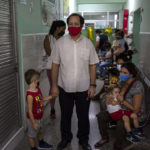 
              Parents wait to have their children vaccinated with the Soberana-02 COVID-19 vaccine, in Havana, Cuba, Thursday, Sept. 16, 2021. Cuba began inoculating children as young as 2-years-old with locally developed vaccines on Thursday. (AP Photo/Ramon Espinosa)
            