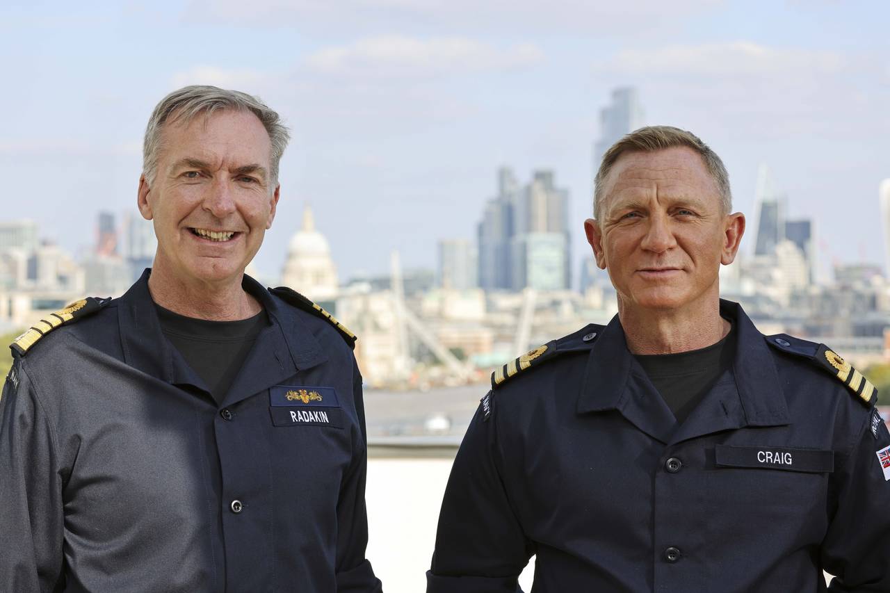 Daniel Craig, right, receives the honorary Royal Navy rank of Commander from the Head of the Royal ...