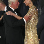 
              Britain's Prince Charles, left, reacts with Kate, the Duchess of Cambridge as they arrive for the World premiere of the new film from the James Bond franchise 'No Time To Die', in London,  Tuesday, Sept. 28, 2021. (Chris Jackson/Pool Photo via AP)
            