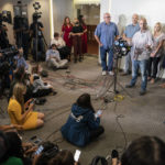 
              Jim Schmidt, stepfather of Gabby Petito, whose death on a cross-country trip has sparked a manhunt for her boyfriend Brian Laundrie, speaks alongside Joseph Petito, father, immediate left, Tara Petito, stepmother, second from right, and Nichole Schmidt, mother, right, during a news conference, Tuesday, Sept. 28, 2021, in Bohemia, N.Y. (AP Photo/John Minchillo)
            