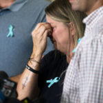 
              CORRECTS SPELLING OF FIRST NAME TO NICHOLE INSTEAD OF NICOLE IN NYJM101-112 - Nichole Schmidt, mother of Gabby Petito, whose death on a cross-country trip has sparked a manhunt for her boyfriend Brian Laundrie, wipes tears from her eyes during a news conference, Tuesday, Sept. 28, 2021, in Bohemia, N.Y. Schmidt, along with Petito's father and two stepparents, were recently tattooed in memory of their child with the words, "Let it be." (AP Photo/John Minchillo)
            