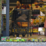 
              Soft drink bottles and broken glass lie in the entrance of a Kroger grocery store Friday, Sept. 24, 2021, in Collierville, Tenn. Police say a gunman, who has been identified as a third-party vendor to the store, attacked people Thursday and killed at least one person and wounded others before being found dead of an apparent self-inflicted gunshot wound. (AP Photo/Mark Humphrey)
            