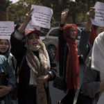 
              Women march to demand their rights under the Taliban rule during a demonstration near the former Women's Affairs Ministry building in Kabul, Afghanistan, Sunday, Sept. 19, 2021. The interim mayor of Afghanistan’s capital said Sunday that many female city employees have been ordered to stay home by the country’s new Taliban rulers. (AP Photo)
            