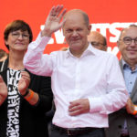 
              FILE - In this Friday, Sept. 24, 2021 file photo, Olaf Scholz, German Finance Minister and Social Democratic Party, SPD, candidate for Chancellor, waves during the final election campaign event in Cologne, Germany. Germany’s closely fought election on Sunday will set the direction of the European Union’s most populous country after 16 years under Angela Merkel, whose party is scrambling to avoid defeat by its center-left rivals after a rollercoaster campaign. (AP Photo/Martin Meissner, POOL, File)
            