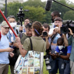 
              Media gather to listen to a person talking as they attend a rally near the U.S. Capitol in Washington, Saturday, Sept. 18, 2021. The rally was planned by allies of former President Donald Trump and aimed at supporting the so-called "political prisoners" of the Jan. 6 insurrection at the U.S. Capitol. (AP Photo/Alex Brandon)
            