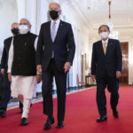 
              President Joe Biden walks to the Quad summit with, from left, Australian Prime Minister Scott Morrison, Indian Prime Minister Narendra Modi, and Japanese Prime Minister Yoshihide Suga, in the East Room of the White House, Friday, Sept. 24, 2021, in Washington. (AP Photo/Evan Vucci)
            