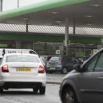 
              Vehicles wait to fill up at a petrol station in Manchester, England, Monday, Sept. 27, 2021. British Prime Minister Boris Johnson is said to be considering whether to call in the army to deliver fuel to petrol stations as pumps ran dry after days of panic buying. ( AP Photo/Jon Super)
            