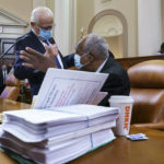 
              Rep. Bill Pascrell, D-N.J., left, and Rep. Danny Davis, D-Ill., confer as the tax-writing House Ways and Means Committee continues working on a sweeping proposal for tax hikes on big corporations and the wealthy to fund President Joe Biden's $3.5 trillion domestic rebuilding plan, at the Capitol in Washington, Tuesday, Sept. 14, 2021. (AP Photo/J. Scott Applewhite)
            