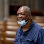 
              Artist Kerry James Marshall, who has been selected to design a replacement of former Confederate-themed stained glass windows that were taken down in 2017 at the National Cathedral, stands in Washington, Thursday, Sept. 23, 2021. The Cathedral has also commissioned Pulitzer-nominated poet Elizabeth Alexander to pen a poem that will be inscribed in the stone beneath the new windows. (AP Photo/Andrew Harnik)
            