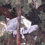 
              In this photo released by Indonesia's National Search and Rescue Agency (BASARNAS), the wreckage of a small Rimbun Air cargo airplane is seen from a rescue helicopter in the mountain near Intan Jaya, Papua province, Indonesia, Wednesday, Sept. 15, 2021. The plane was reported missing 50 minutes after it took off Wednesday in the country's easternmost province. (BASARNAS via AP)
            
